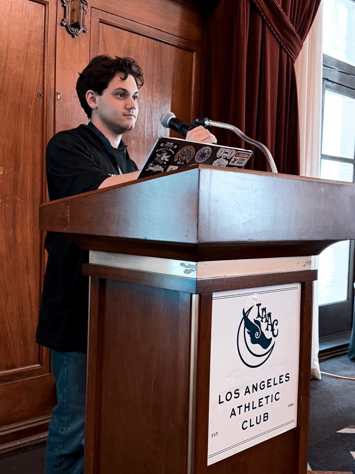 Joshua Rashtian speaking at an event
